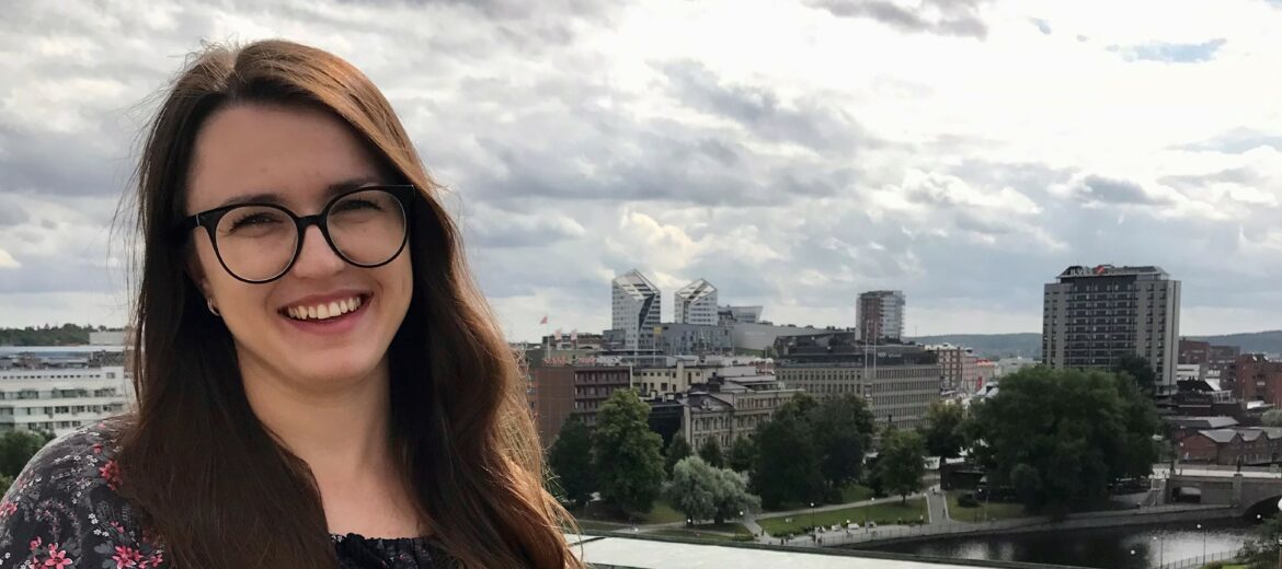 Visual peace project-owner Lisa Glybchenko standing smiling on the roof-top of Finlayson.